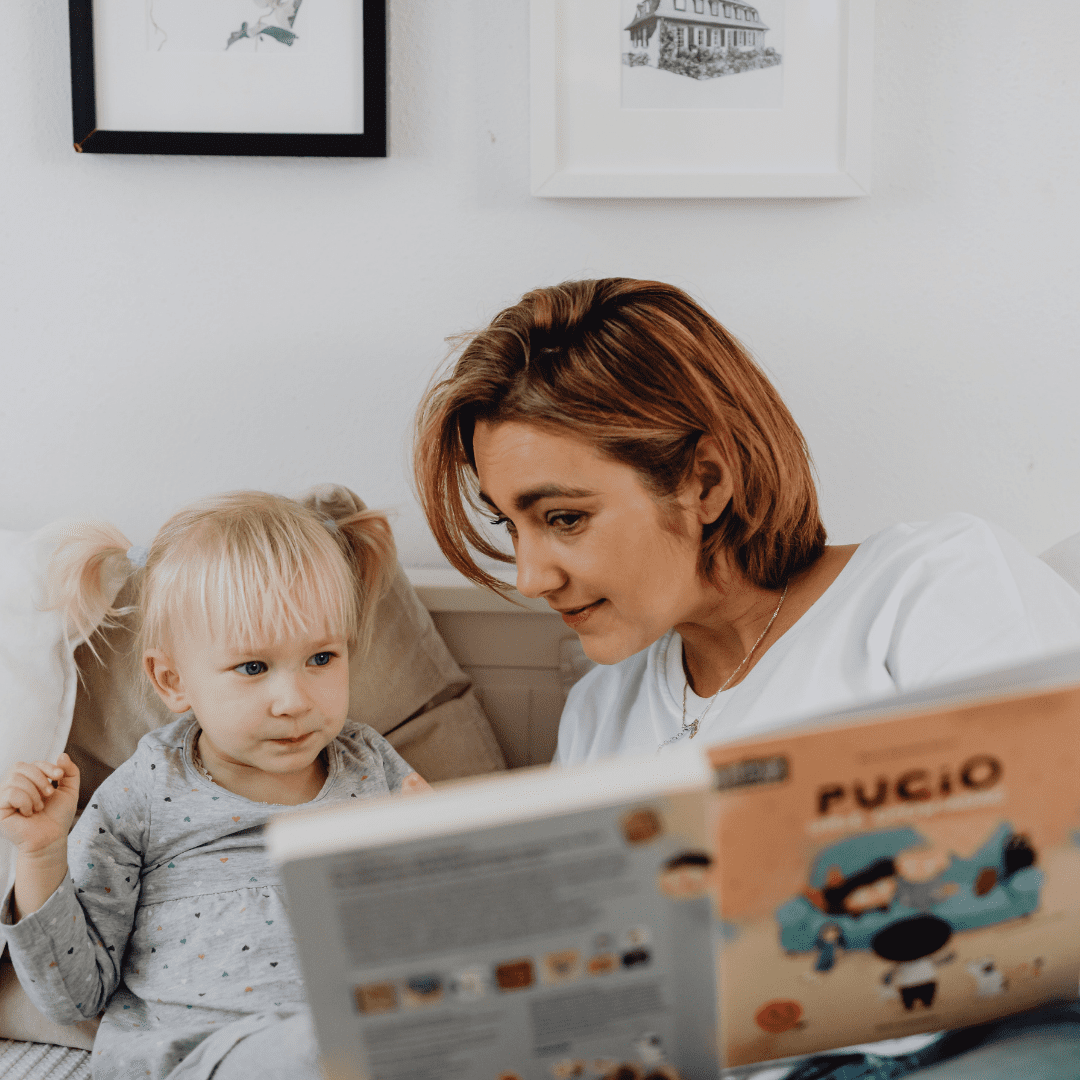 mom reading story to child
