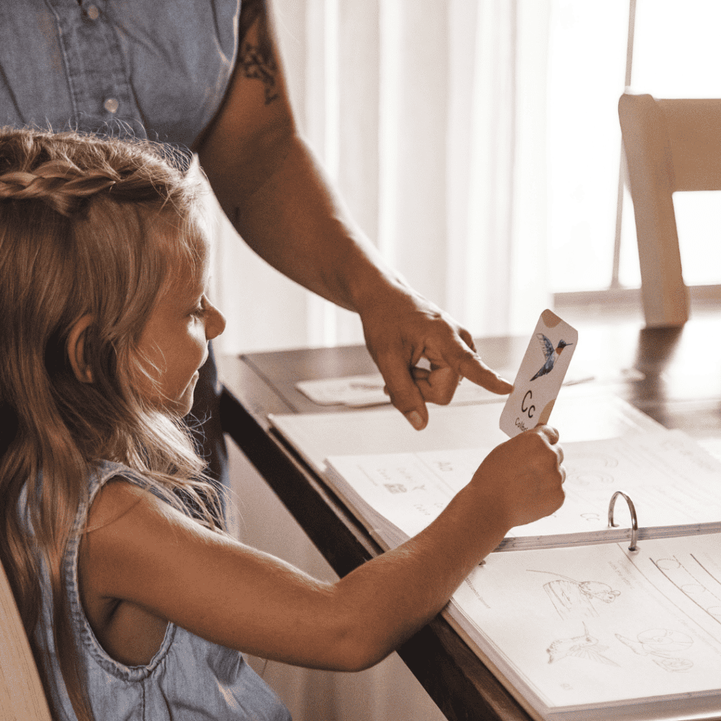 Homeschool mom pointing to a Spanish sight word on a flashcard