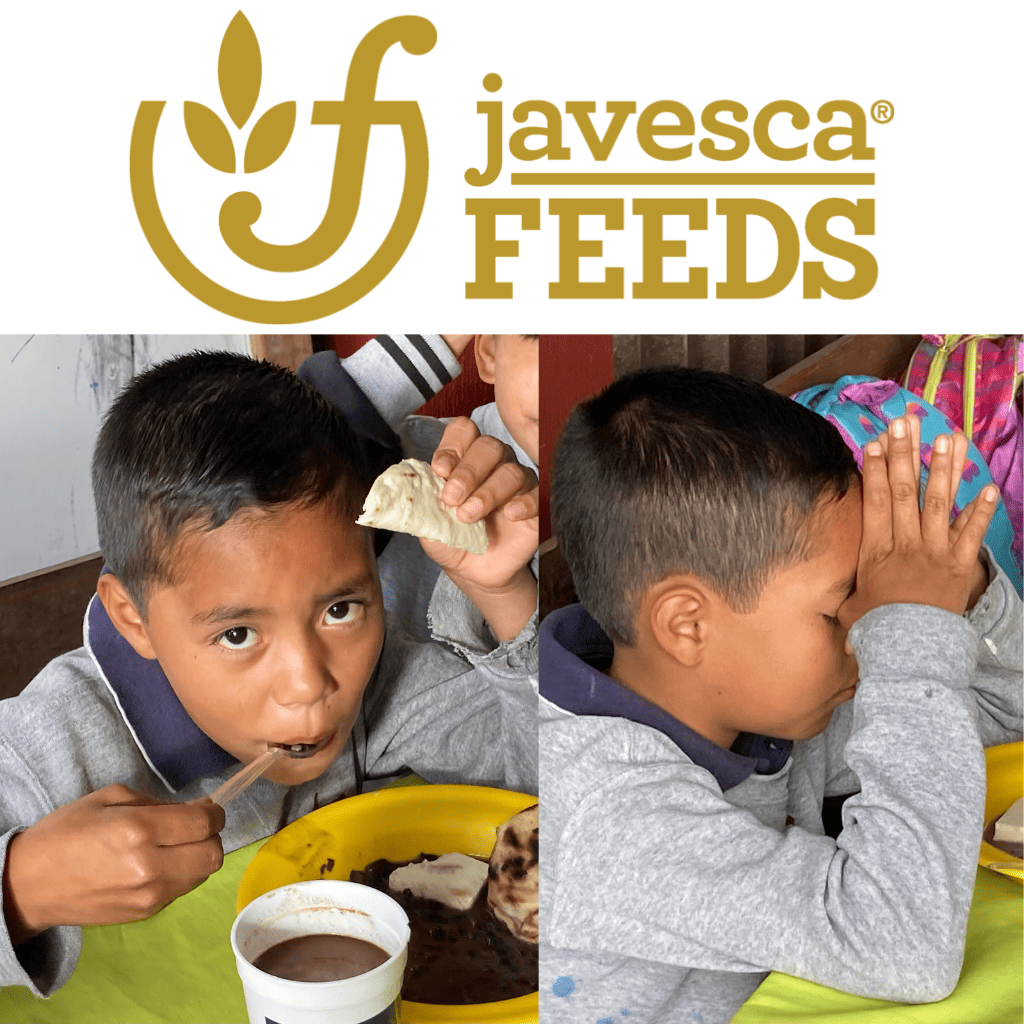 child praying and eating a meal in Guatemala