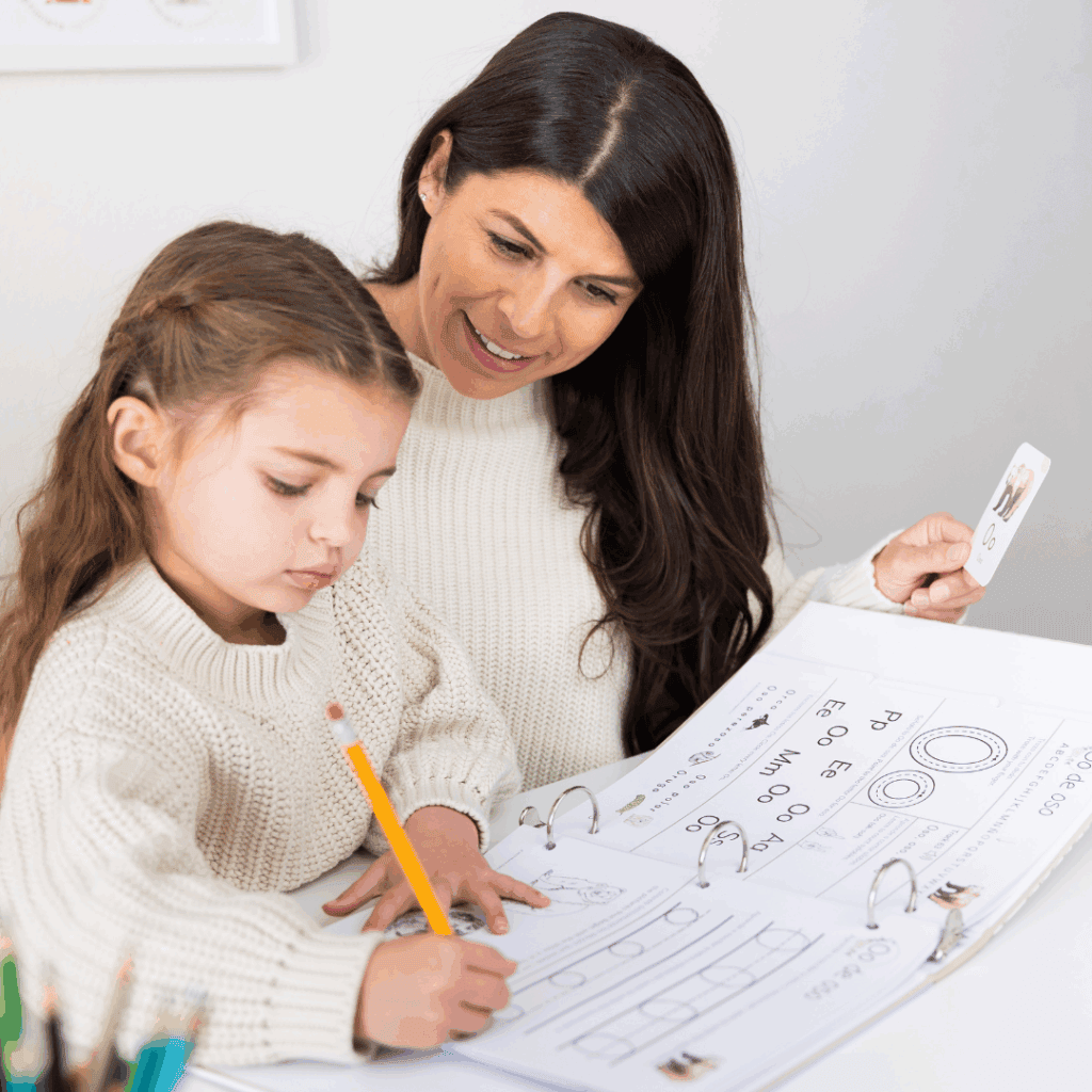 mom and daughter completing the Preschool Spanish Morning Binder